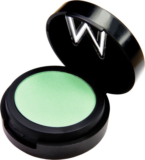 Green eyeshadow in a round, black container with a large silver 'W' on the lid.