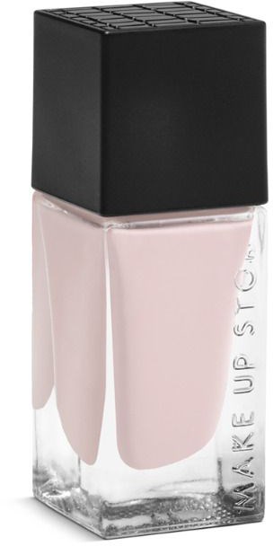 En ljus rosa nagellackflaska med svart lock, märkt M.A.K.E UP ST.O.