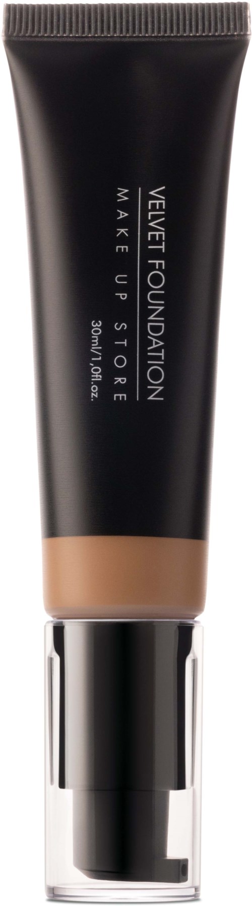 En svart makeup-rör med beige lock, märkt 'Velvet Foundation' av Make Up For Ever.