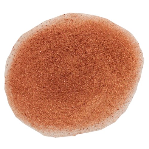 Ett runt, orangebrunt föremål med något grov yta och mörkare fläckar på ytan.