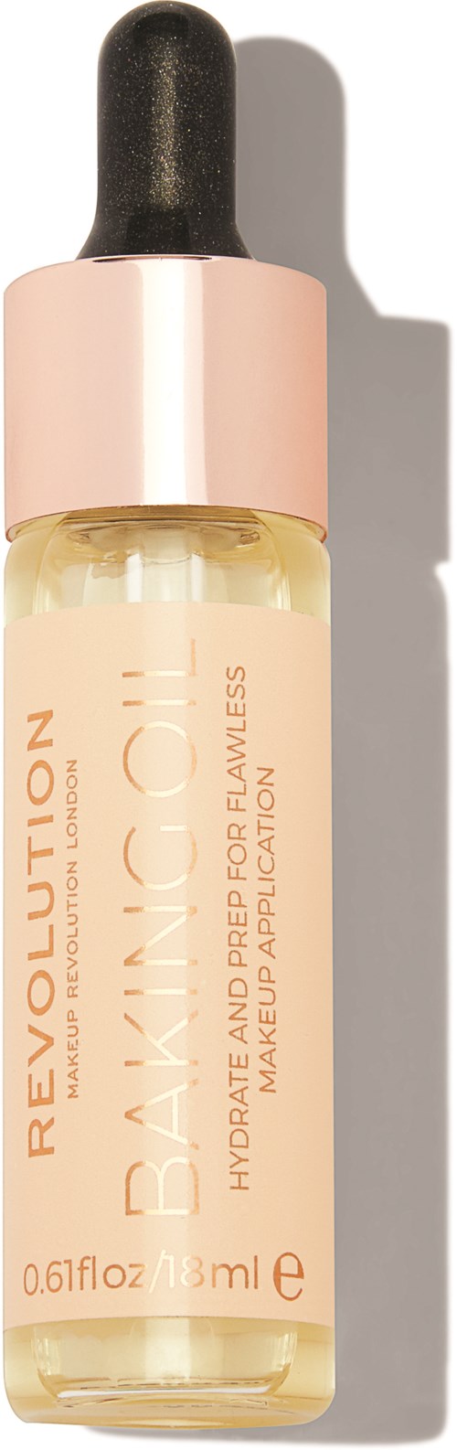 A small bottle of Revolution brand baking oil, designed to hydrate skin, with a black dropper cap and pink bottle collar.