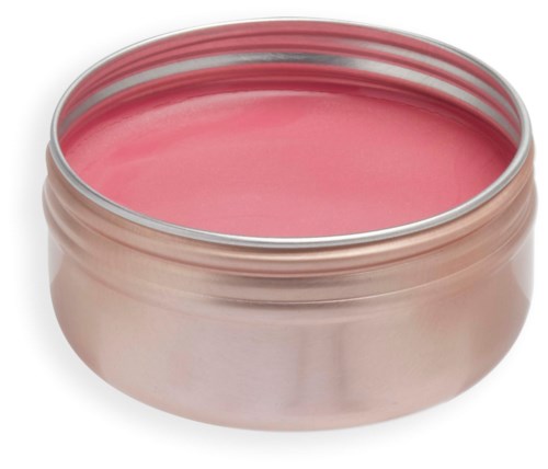 A round, open metal container filled with pink paste or cream, smooth surface. It looks like a cosmetic product.
