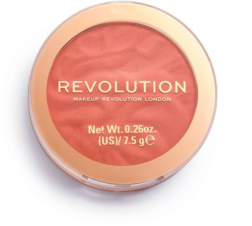 En rund makeup-kompakt med ett persikofärgat lock, märkt 'Revolution Makeup Revolution London,' innehåller rouge.