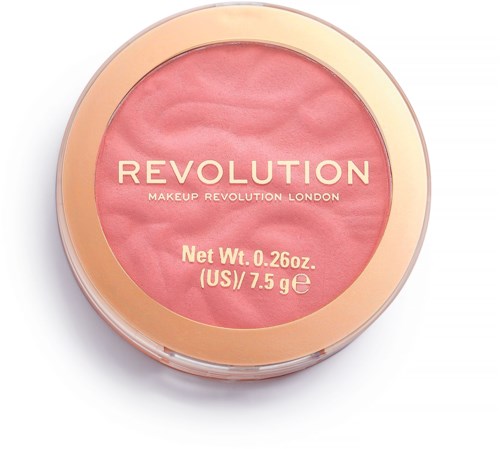 Rund makeupbehållare med rosa rouge inuti, guld- och genomskinlig lock, och varumärket 'Revolution' på toppen.