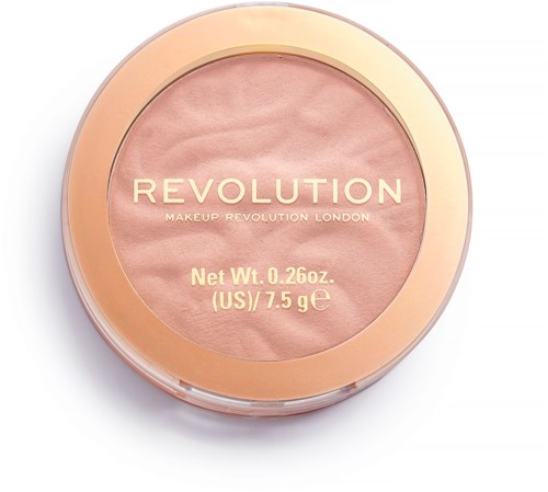 Ett runt makeup-produkt med rosa puder innuti och en gyllene kant, märkt 'Revolution' från London.