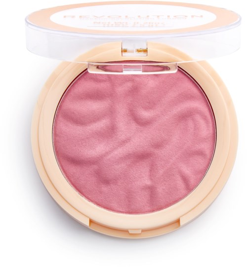 Rodnande puder i en runt kompakt med beige hölje och genomskinligt lock, lätt texturerad yta, rosa färg.