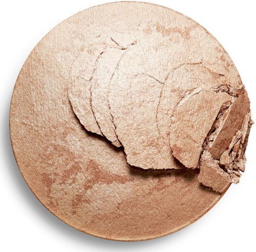 En rund, beige pulver som har några brutna bitar på toppen, liknar bakat eller pulveriserat mat.