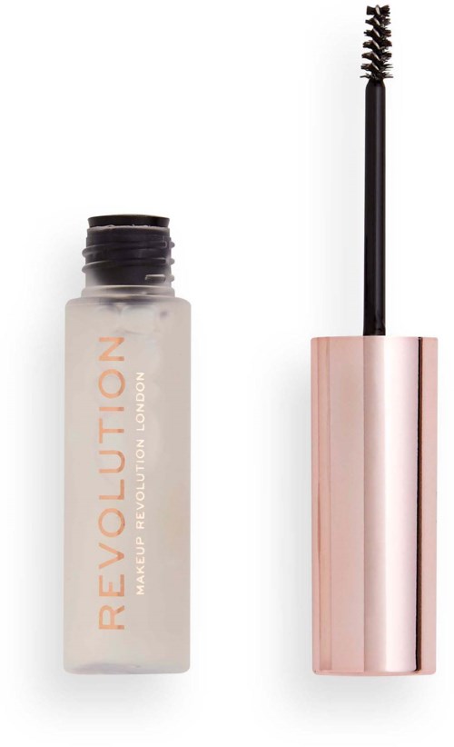 En liten makeupflaska med en applikator bredvid, märkt 'REVOLUTION Makeup Revolution London'.