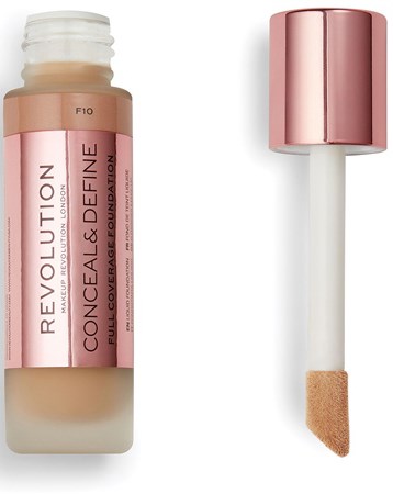 En concealerflaska med rosa lock och applikator, märkt "Revolution Conceal & Define" för smink.