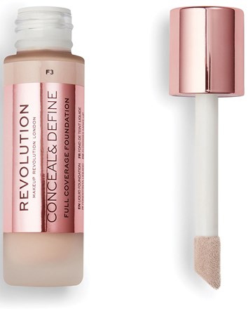 En foundationflaske med rosa lokk og en applikator med svampespiss.