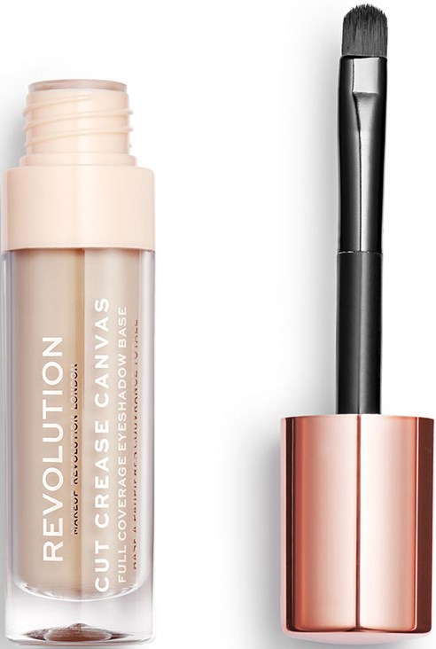 Ett concealer-rör märkt "Revolution" bredvid en sminkborste med ett roséguldhandtag.