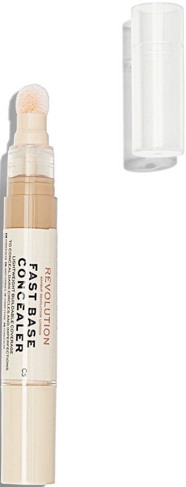 En beige concealer-stift med vit lock, märkt 'Revolution Fast Base Concealer', med locket borttaget och applicatorn synlig.