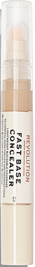En vit penna med tydligt genomskinlig mittdel visar tre nyanser av foundation inuti, märkt Revolution Fast Base Concealer.