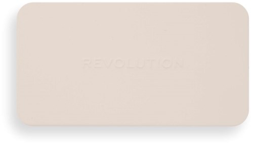 Beige suorakulmainen esine, jossa on teksti 'REVOLUTION', mustalla taustalla.