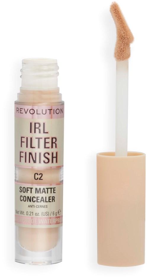 A concealer tube labeled 'IRL FILTER FINISH' with an open applicator showing beige product.