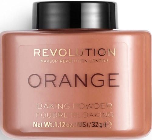En aprikosfärgad burk med bakpulver och svart lock, märkt 'REVOLUTION' och 'ORANGE'.