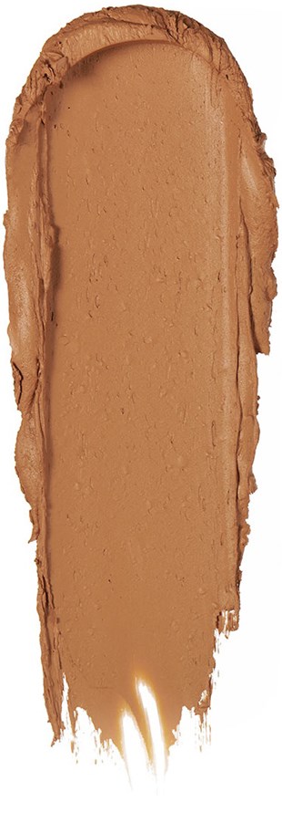En bred smet av brun substans med ojämna kanter, liknande ett krämigt kosmetiskt eller matvaruprov.