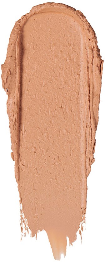 En provbit av beige foundation eller concealer med ojämna kanter.