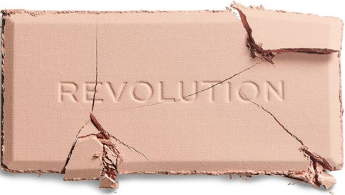 Ett rosa ämne sönderbrutet i bitar med ordet "REVOLUTION" inhugget.