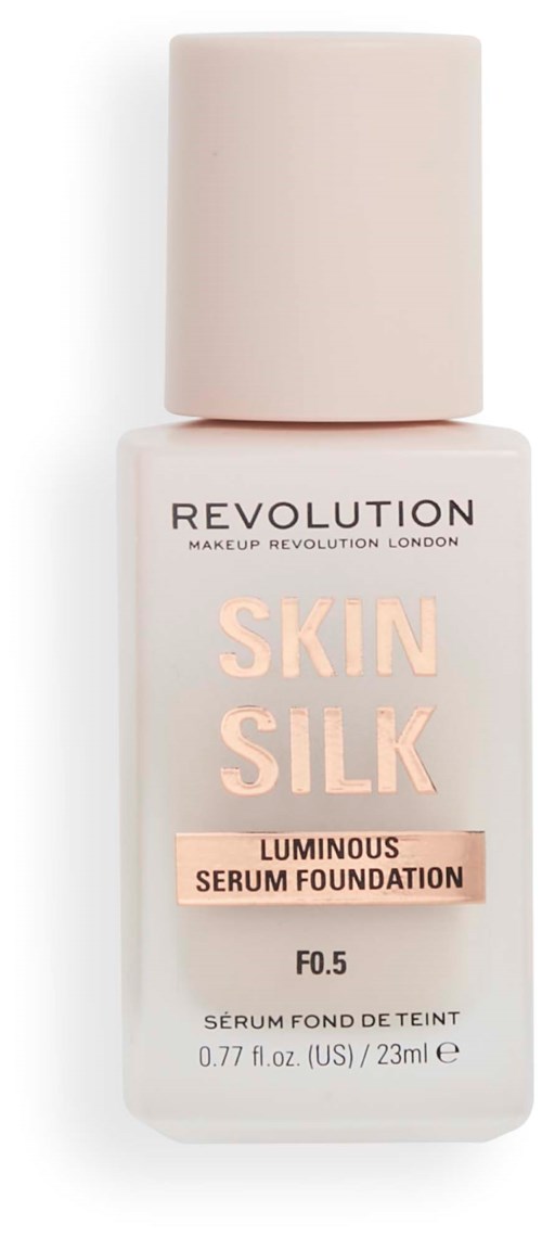 Eine Flasche Revolution Skin Silk leuchtende Serum-Foundation mit weißem Verschluss.