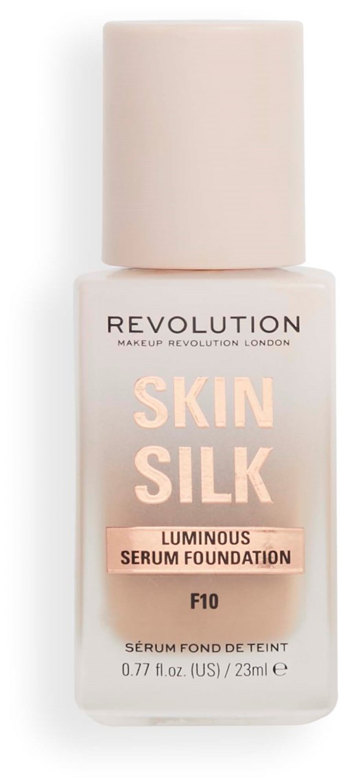 A bottle of foundation labeled 'Skin Silk' with a pale pink cap and simple white and pink design.