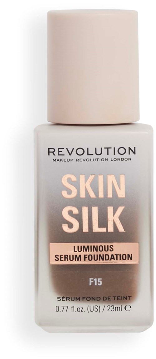Eine weiße Flasche mit SkinSilk leuchtendem Serum-Foundation, beschriftet mit Markenname und Produktdetails.