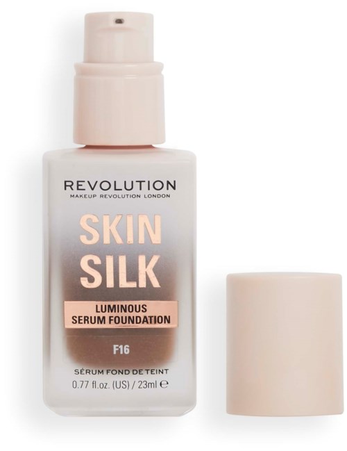 Eine Foundationflasche mit Pumpe und Deckel, gekennzeichnet 'Skin Silk' und 'Luminous Serum Foundation'.