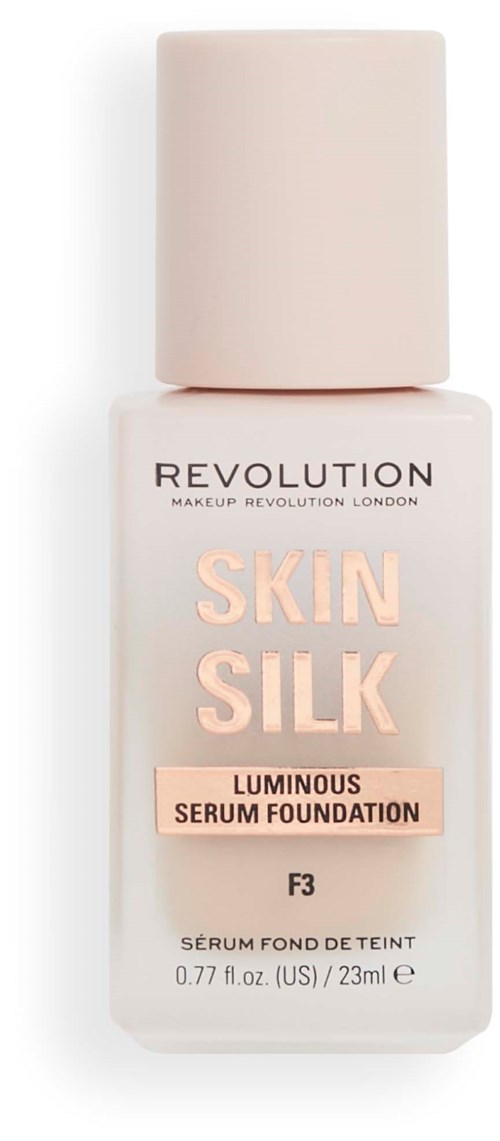 En foundationflaska märkt 'Skin Silk' med en ljus rosa kork och enkel design från Revolution Makeup London.