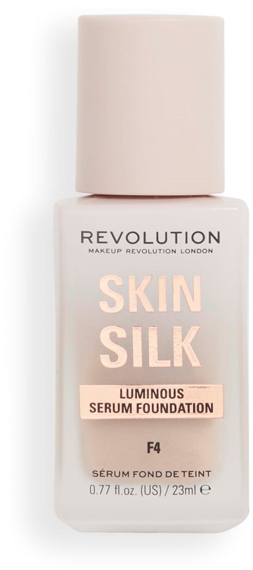 A bottle of foundation labeled 'Skin Silk' by Revolution, with a large light-colored cap, and light pink text.