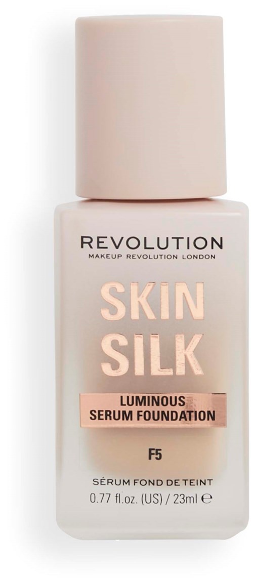 En flaska foundation som heter Skin Silk av Revolution, med mjuka rosa och beige färger, märkt som glänsande serum.