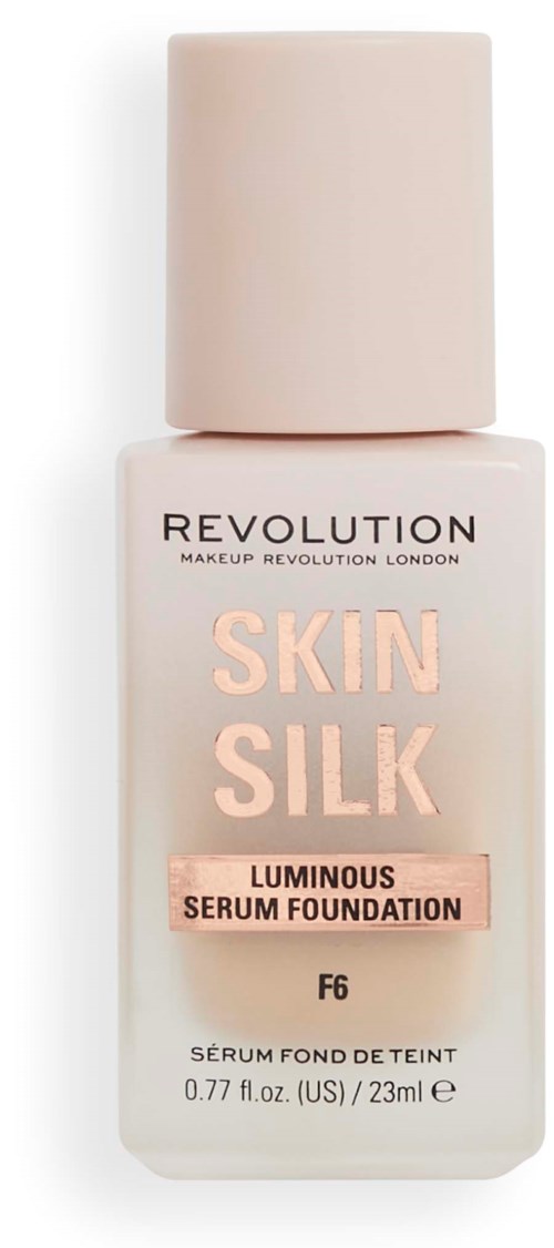 En vit flaska med beige lock och rosa text, märkt som Skin Silk lystergivande serumfoundation, F6, från Revolution.