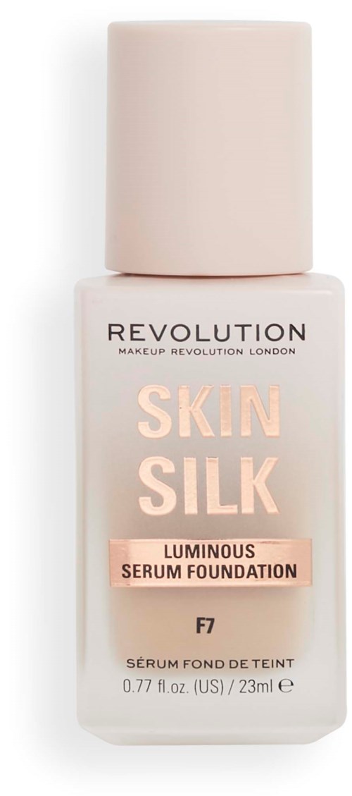 A bottle of foundation labeled Skin Silk, with a light pink cap and soft pink and peach text.