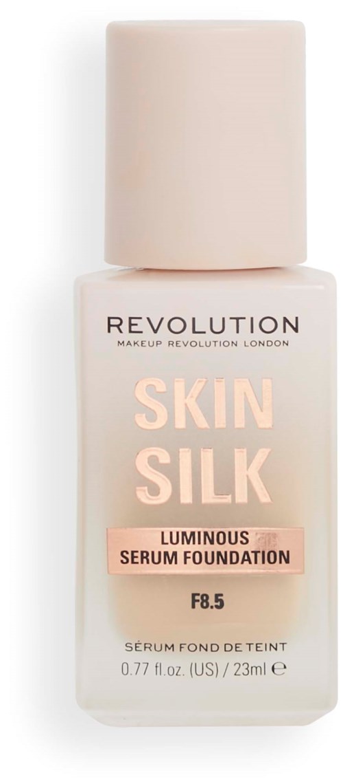 A beige foundation bottle with a white cap, labeled 'Skin Silk Luminous Serum Foundation' by Revolution.