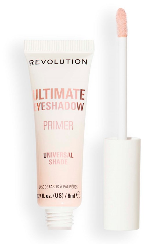En tub med Revolution ögonskuggsprimer med applikator. Vitt och rosa förpackning, märkt "Ultimate Eyeshadow Primer."