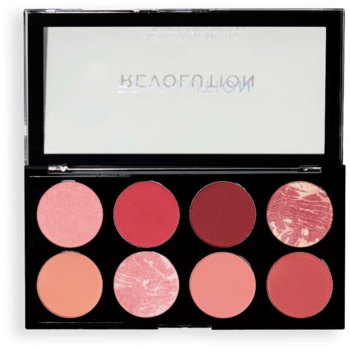 Makeup palette with eight pink and red shades, some with marbled or matte finishes.