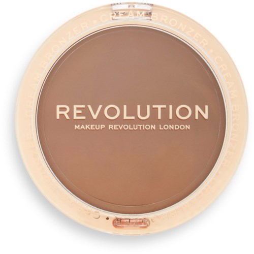 Rund makeup-kompakt med beige lock och brunt puder inuti. Text på locket lyder "REVOLUTION MAKEUP REVOLUTION LONDON."