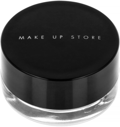 A round glass container with a black lid. The lid has white text that says "MAKE UP STORE."