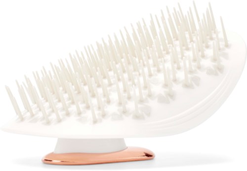 A white hairbrush with many soft bristles and a rose gold bottom, designed for gentle brushing.