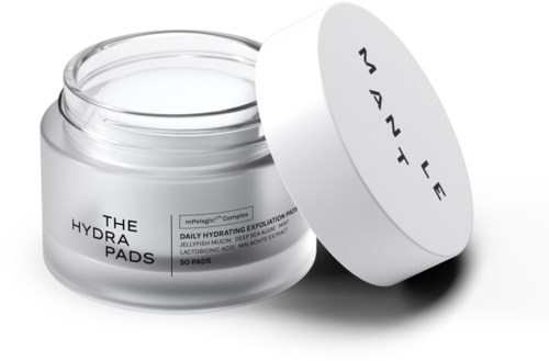 Arkkipurnassa kosteusvoiteenestosuihkepaloja, kannessa valkoinen kansi, teksti 'The Hydra Pads' ja 'Daily Hydrating Exfoliation.'