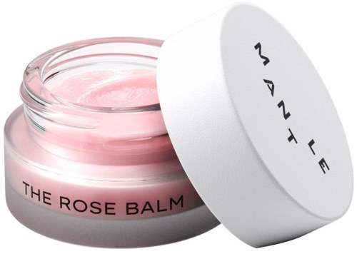 Różowy balsam w okrągłym słoiku z białą pokrywką, oznaczony "The Rose Balm" i "Manly".