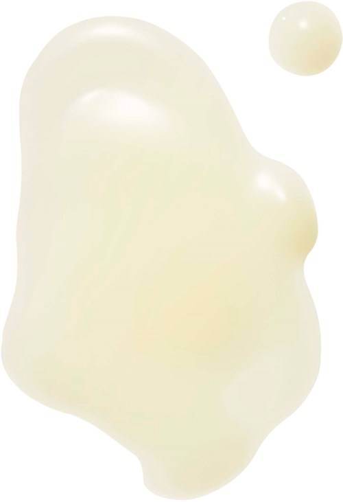 Een beige, onregelmatige gevormde vloeistofmassa met een kleine ronde druppel in de buurt.
