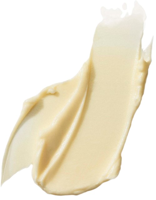 Ett drag av krämig vit chokladsås på en vit bakgrund.