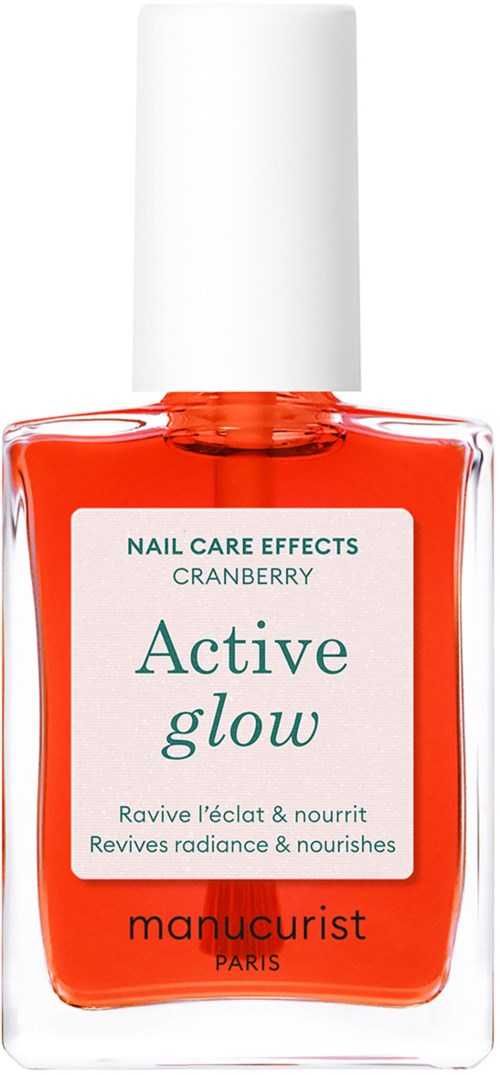 En flaske neglelakk med hvit lokk, oransje farge, og etikett som sier 'Active glow' og 'manucurist Paris.'