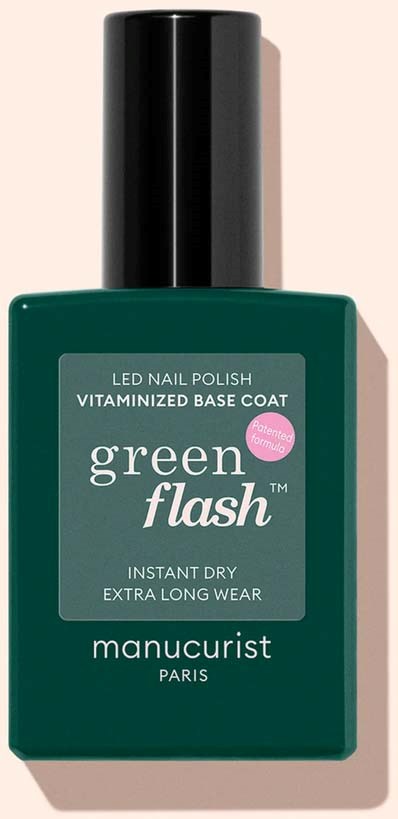 Grøn neglelakflaske med sort låg og label, der angiver LED, vitaminiserende base coat, langvarig manicure.