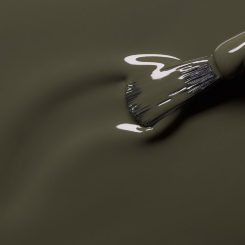 A paintbrush applying paint on a surface, with glossy dark grey or black paint visible.