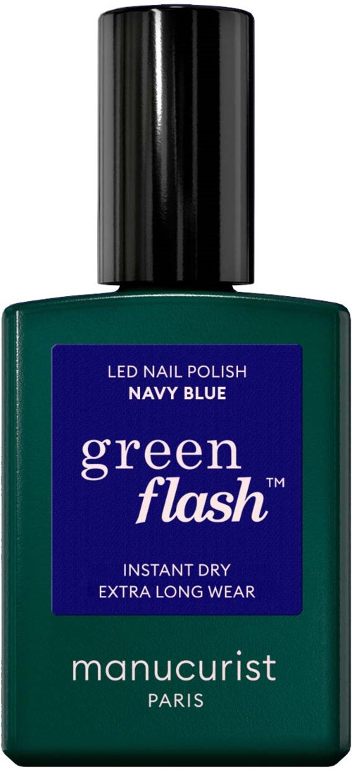 Vihreä pullo navy blue -kynsilakkaa Manucuristilta, etiketti 'green flash', kestää pitkään ja kuivuu nopeasti.