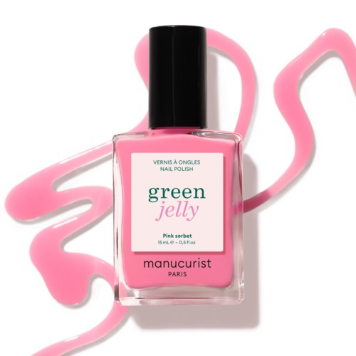 Różowa butelka lakieru do paznokci z etykietą green jelly, pink sorbet i Manucurist Paris. Różowa farba otacza ją.