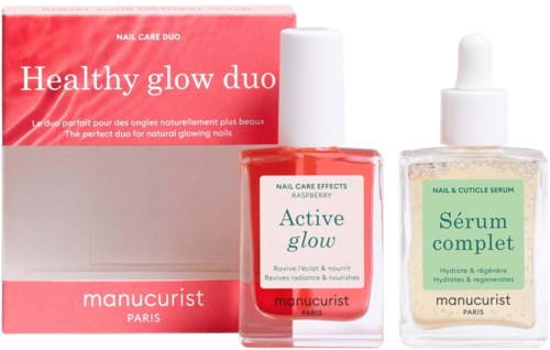 Skönhetsprodukter för naglar visar en rosa box märkt Healthy glow duo, ett hallon nagelserum och ett klart nagelbandserum.