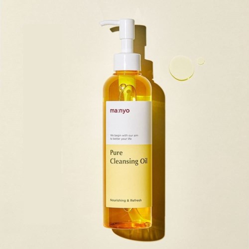 A yellow transparent bottle with a pump, labeled 'Pure Cleansing Oil', standing against a light background.