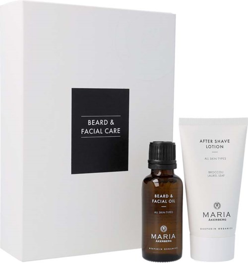 Parta ja kasvojenhoitosetti, johon sisältyy pieni ruskea pullo parta- ja kasvoöljyä ja valkoinen after shave -rasvatuubi.